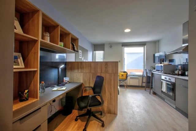 Desk chair shelves microwave oven kitchen studio apartment at Curraheen Point in Cork Student Accommodation