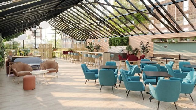 Teal chairs and lounge seating common area at Ardee Point in Dublin Student Accommodation