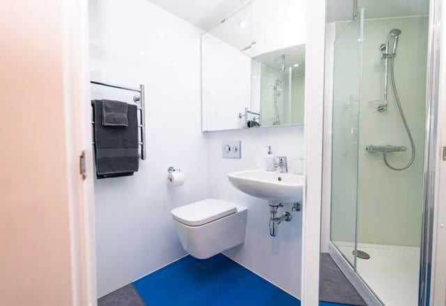 Toilet sink shower towels heated rack bathroom at Stephen's Quarter in Dublin Student Accommodation
