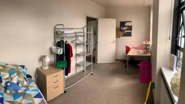 Bed desk and clothing rack bedroom at UniLodge Stafford House in Wellington Student Accommodation