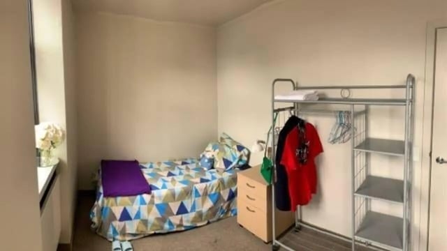 Bed dresser metal rack clothing bedroom at UniLodge Stafford House in Wellington Student Accommodation