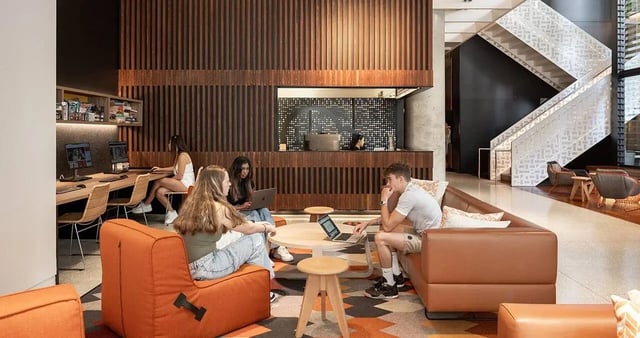 Students study at computers and lounge areas living room at Iglu Brisbane City in Brisbane Student Accommodation