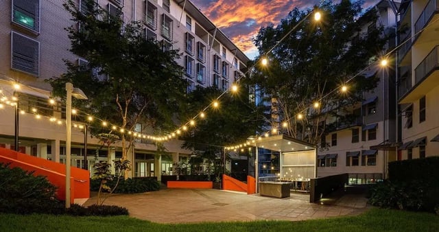 Courtyard with string lights and seating exterior at Iglu Kelvin Grove in Brisbane Student Accommodation