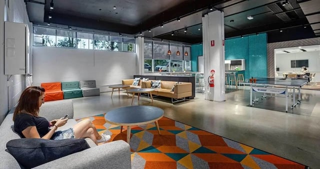 Sofa ping pong table modern lounge area living room at Iglu Kelvin Grove in Brisbane Student Accommodation