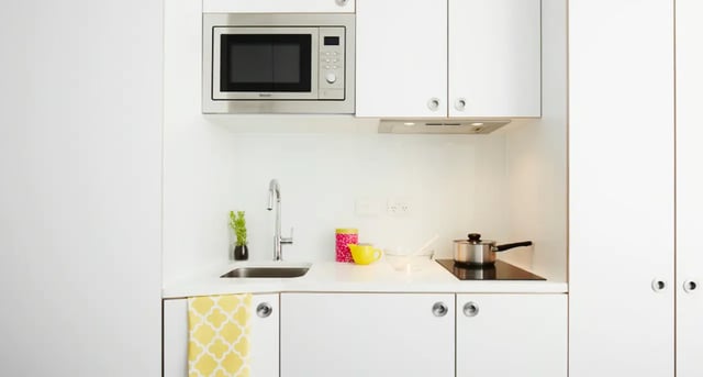 Microwave sink pot yellow cup kitchen at Scape Abercrombie in Sydney Student Accommodation