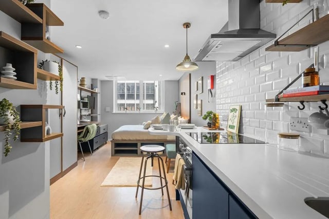 Bed study kitchen with modern furniture studio apartment at Pennine House in Leeds Student Accommodation