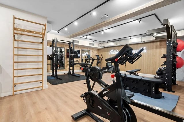 Wall ladder bikes racks weights gym room at Pennine House in Leeds Student Accommodation