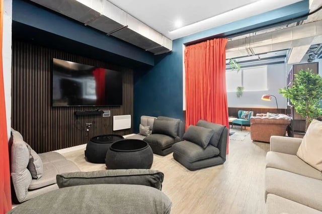 Comfortable seating and television in lounge area at Pennine House in Leeds Student Accommodation