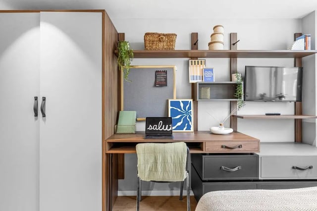 Desk with laptop and chair study area at Pennine House in Leeds Student Accommodation