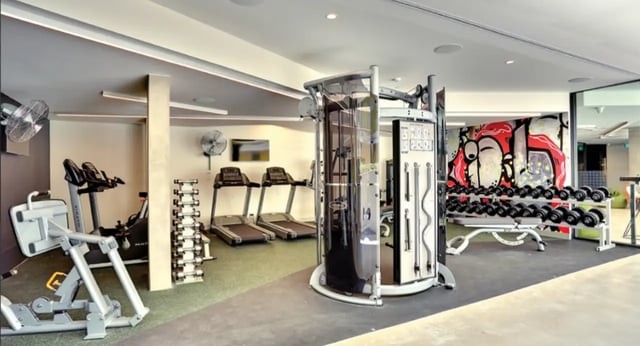 Gym equipment including treadmills dumbbells and cable machine gym at Scape Glebe in Sydney Student Accommodation