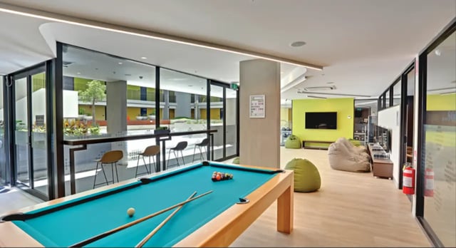 Pool table bar stools beanbags television living room at Scape Glebe in Sydney Student Accommodation