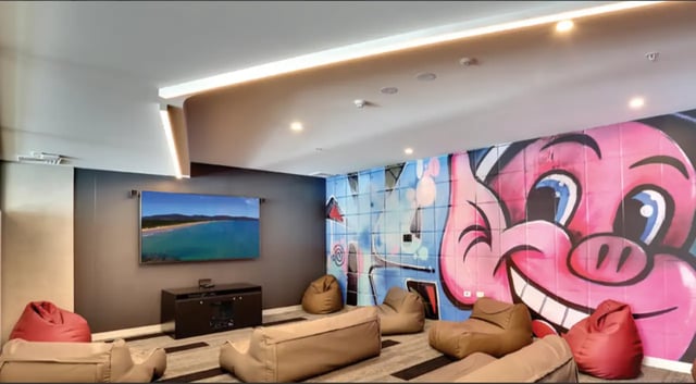 Bean bags TV mural and seating area living room at Scape Glebe in Sydney Student Accommodation