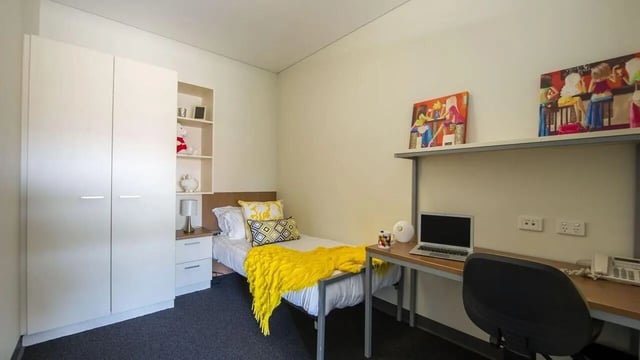 Bed desk and wardrobe student bedroom at UniLodge @ Metro Adelaide in Adelaide Student Accommodation