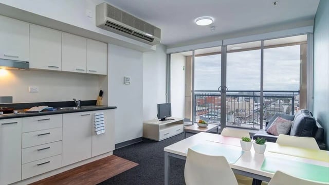 Kitchen living room with sofa and dining table Living room at UniLodge @ Metro Adelaide in Adelaide Student Accommodation