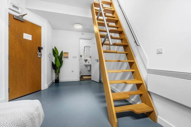 Wooden stairs plant door bathroom interior at Algernon Firth in Leeds Student Accommodation