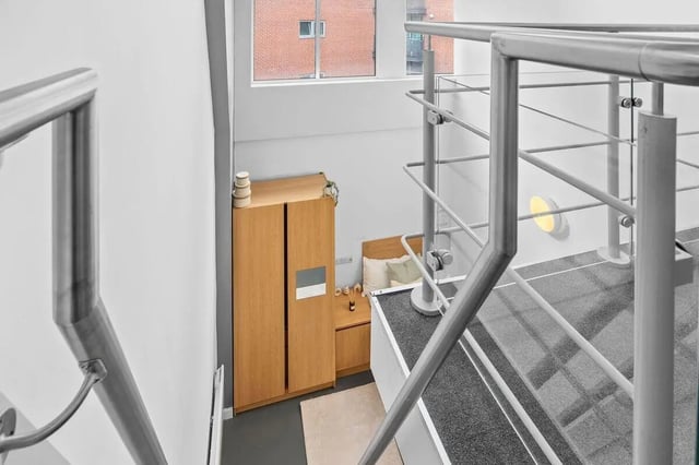 Wooden wardrobe bed and nightstand bedroom at Algernon Firth in Leeds Student Accommodation