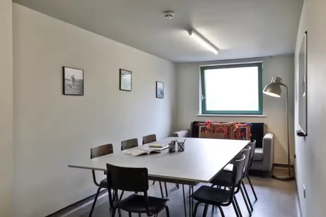 Table chairs sofa and lamp communal area at Ayton House in St Andrews Student Accommodation