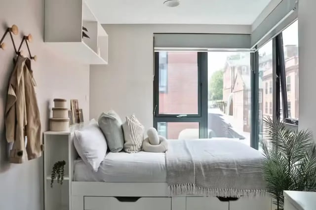 Bed with pillows blanket and storage bedroom at Portobello House in Sheffield Student Accommodation