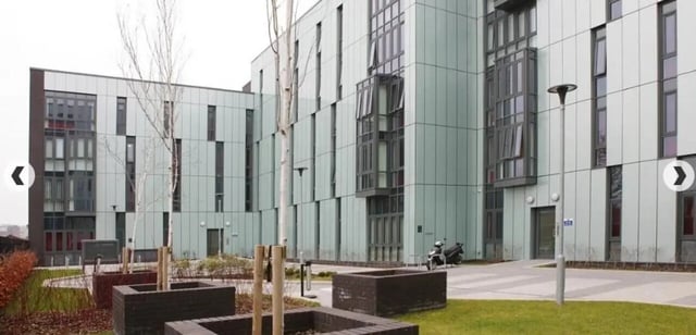 Modern building facade with trees and planters Exterior at Grenville Street in Liverpool Student Accommodation