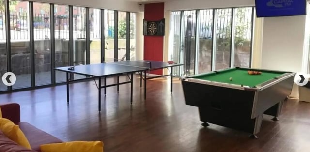 Ping pong table pool table dartboard living room at Grenville Street in Liverpool Student Accommodation