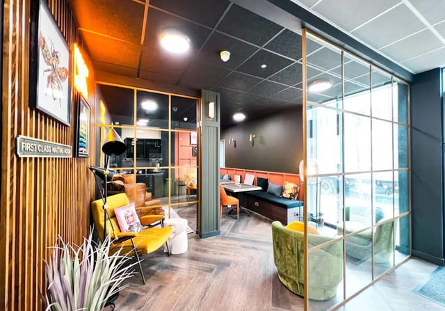 Yellow armchair leather seating modern communal area lounge at Lady Nicolson Court in Edinburgh Student Accommodation