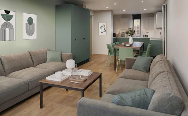 Sofas coffee table artwork green kitchen dining living area at Arasain P&V in Dublin Student Accommodation