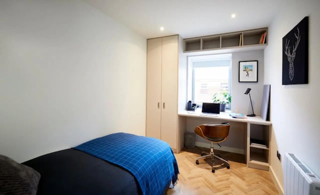 Bed desk chair and closet student bedroom at Arasain P&V in Dublin Student Accommodation