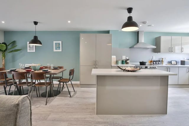 Dining table chairs island kitchen area kitchen at Ocean View in Falmouth Student Accommodation