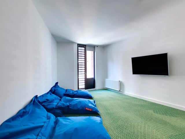 Blue beanbags TV and window lounge area at Lee Point in Cork Student Accommodation