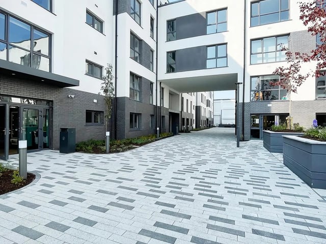Modern student accommodation exterior with brick and white walls Exterior at Melbourn Point in Cork Student Accommodation