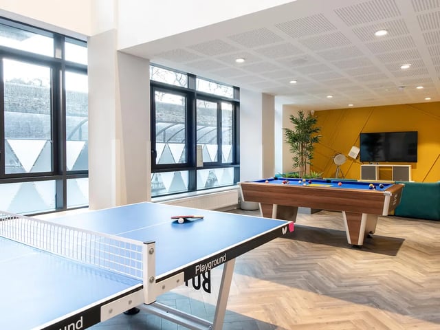 Ping pong table pool table television plant living room at Ardcairn House in Dublin Student Accommodation