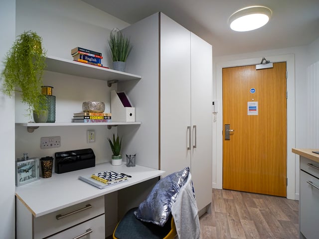 Desk with chair shelves and wardrobe study area at Goods Corner in Edinburgh Student Accommodation