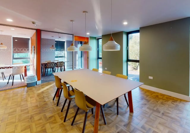 Communal dining table with chairs study area at Goods Corner in Edinburgh Student Accommodation