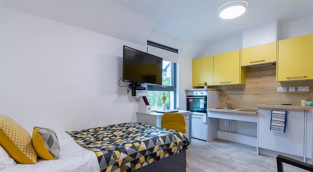 Bed TV desk kitchen and cabinets studio apartment at Goods Corner in Edinburgh Student Accommodation