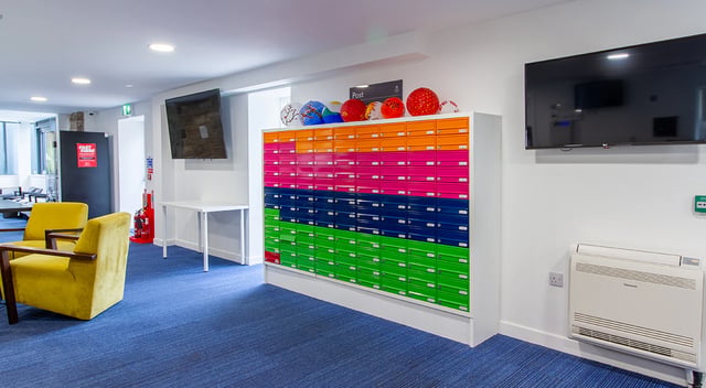 Mailboxes with lamps chairs and television Common area at Goods Corner in Edinburgh Student Accommodation