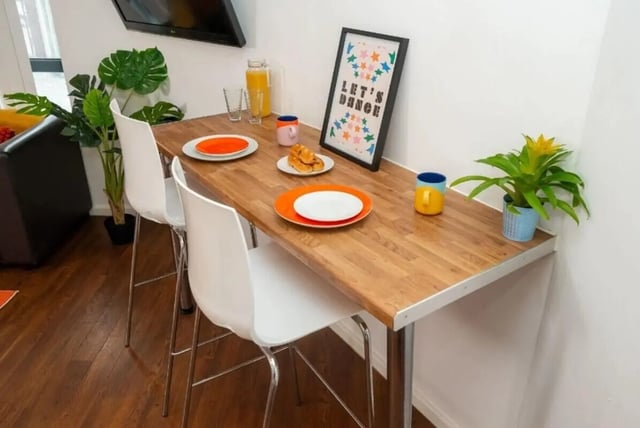 Dining table with plates mugs and plants kitchen at Marybone Student Village 3 in Liverpool Student Accommodation