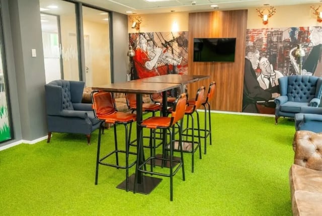 Seating area with high tables and chairs Living room at Marybone Student Village 3 in Liverpool Student Accommodation