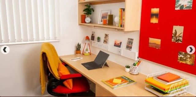Desk with laptop chair and shelves Study Area at Marybone Student Village 3 in Liverpool Student Accommodation