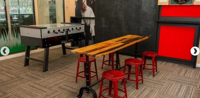 Foosball table and red stools communal area at Marybone Student Village 3 in Liverpool Student Accommodation