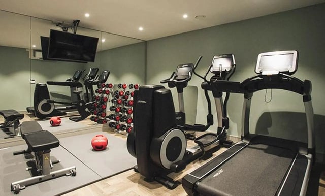 Elliptical treadmill bench weights mirror gym at Canvas The Parade in Cardiff Student Accommodation