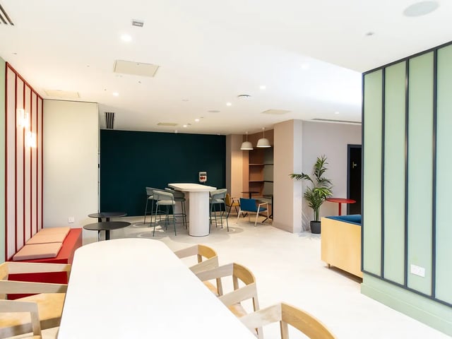 Dining tables high chairs and lounge seating common area at Brewers Close in Dublin Student Accommodation
