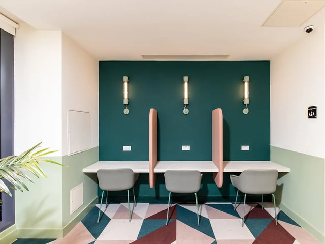 Three chairs at desk with partitions study area at Brewers Close in Dublin Student Accommodation