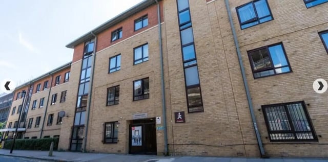 Brick student accommodation building with multiple windows exterior at Coopers Court in London Student Accommodation