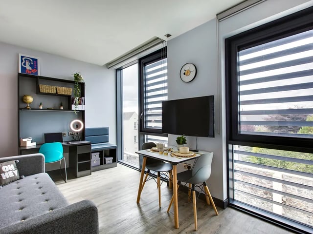 Sofa desk and dining table living room at New Mill in Dublin Student Accommodation
