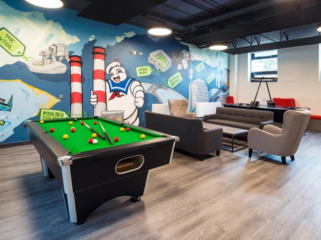 Pool table sofas armchairs communal area living room at New Mill in Dublin Student Accommodation