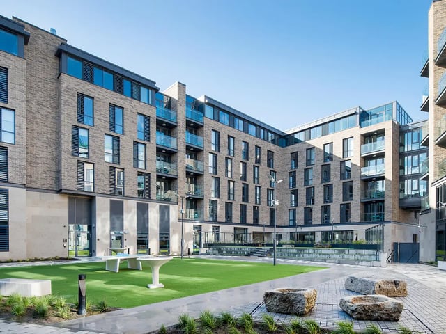 Courtyard with modern buildings and seating Exterior at New Mill in Dublin Student Accommodation