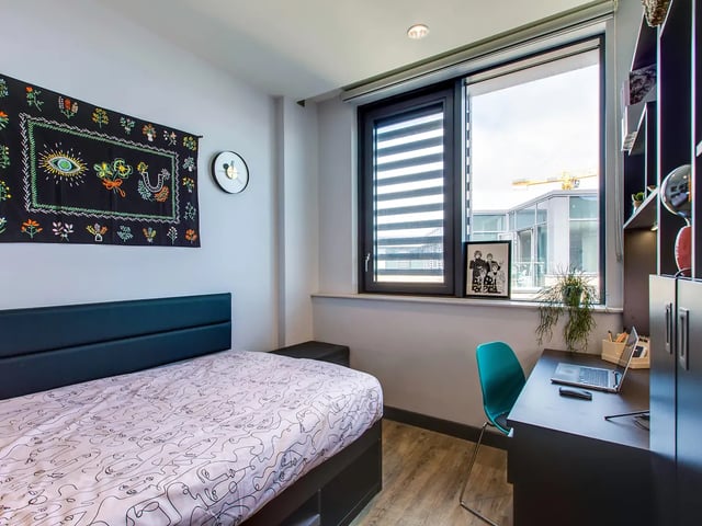 Bed desk chair artwork and window bedroom at New Mill in Dublin Student Accommodation