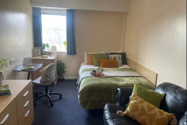 Bed with pillows desk chair and drawers Bedroom at Dinwiddy House in London Student Accommodation