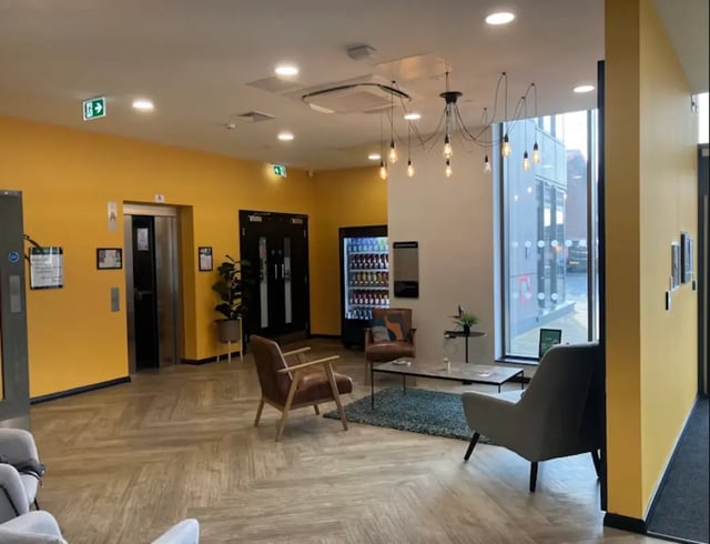 Seating chairs elevators vending machine lounge area at Little Patrick Street in Belfast Student Accommodation