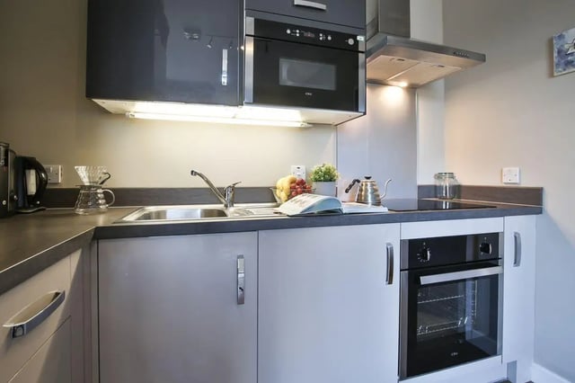 Sink kettle oven cabinets and microwave kitchen at Library Lofts in Exeter Student Accommodation